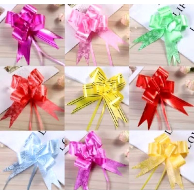

Pita Tarik Sedang 23mm/ Pita Serut Hiasan Parcel Souvenir Kado Pull Flower