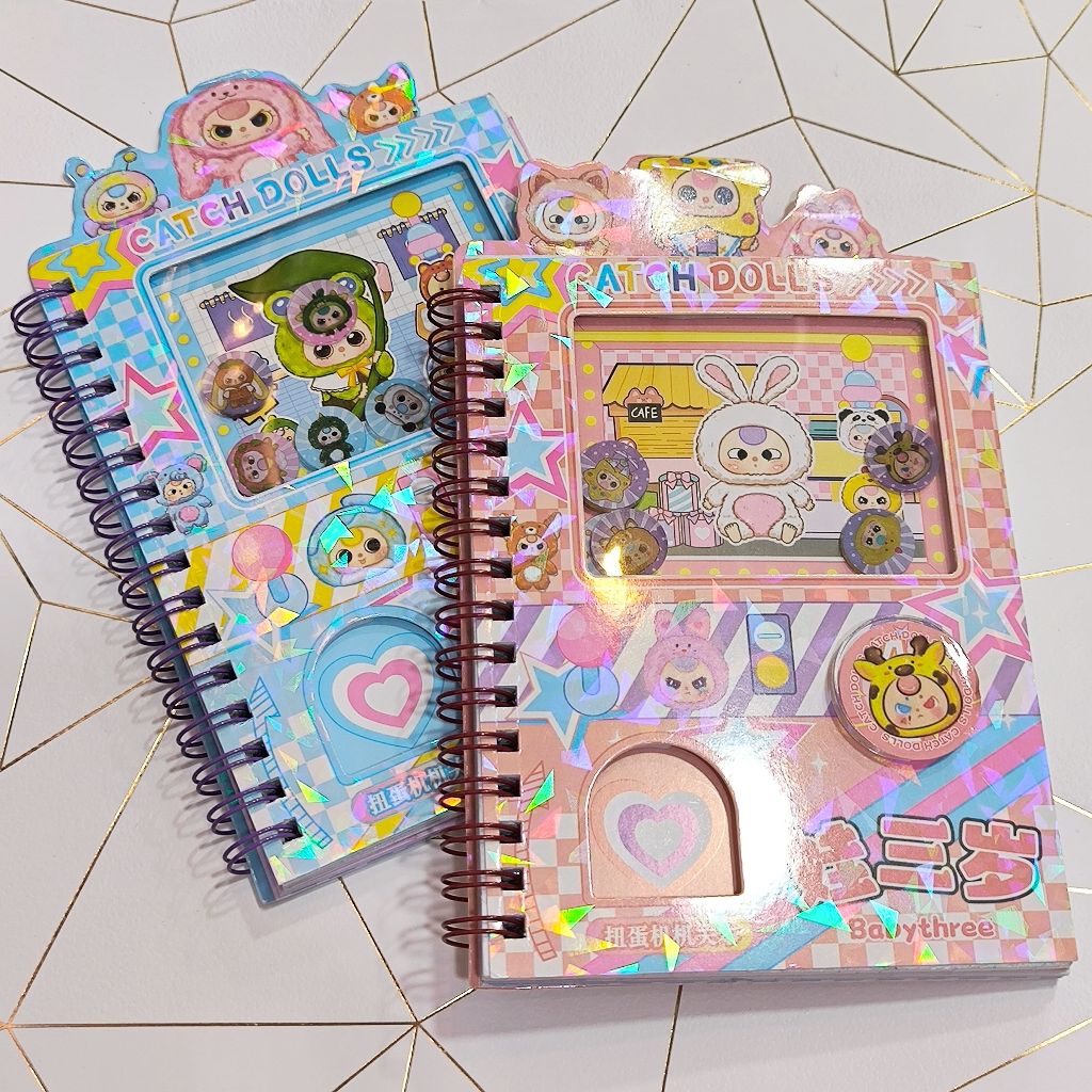 

note book stiker + mainan koin baby three