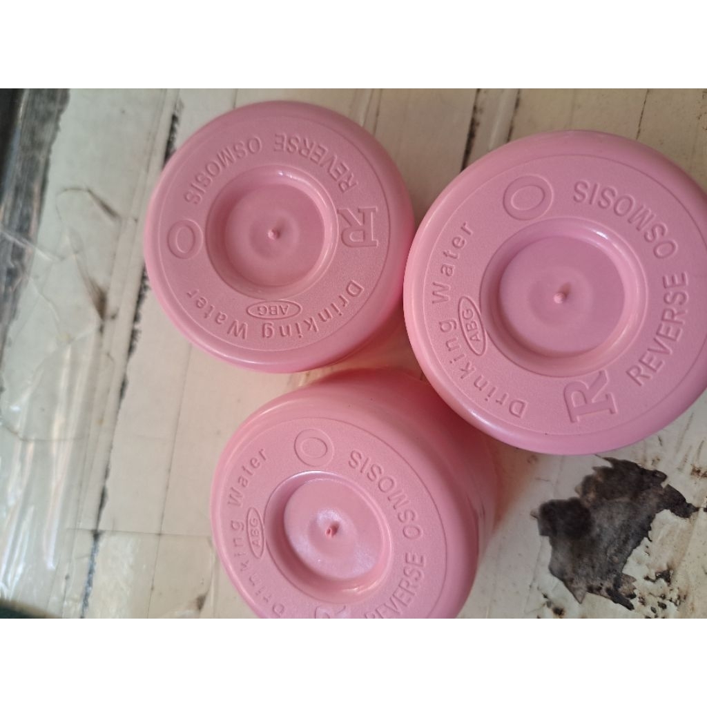 tutup galon air isi ulang.tutup isi ulang warna pink muda dekok susun RO  isi 1000pcs(pembelian 3 ba