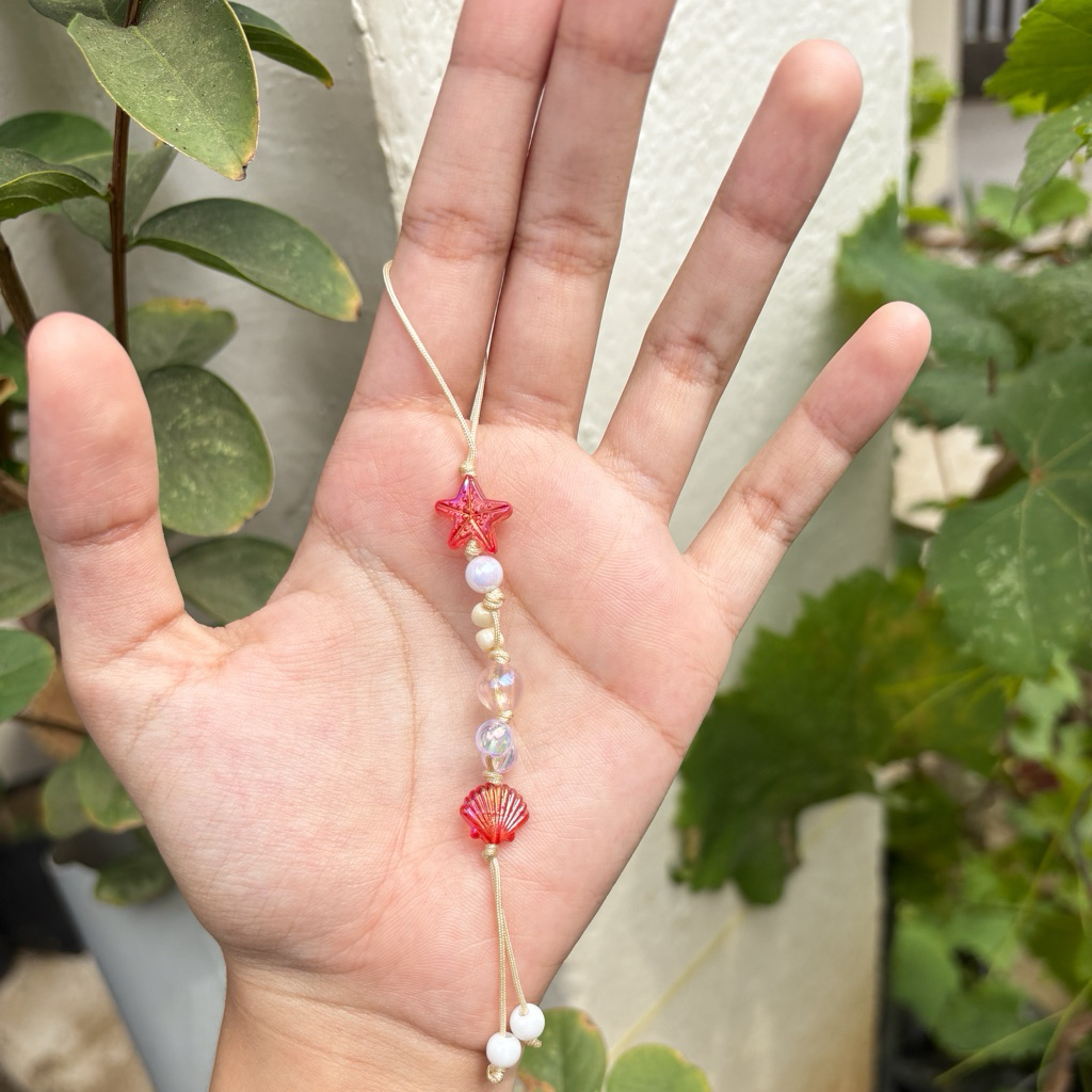 phone charm bintang laut merah merona