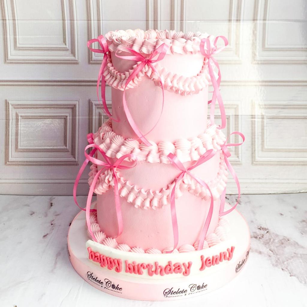 

Kue Ulang Tahun/Birthday Cake/Kue Ultah tema Ribbon Pink/Kue 2 Tingkat/Kue Pink Ribbon