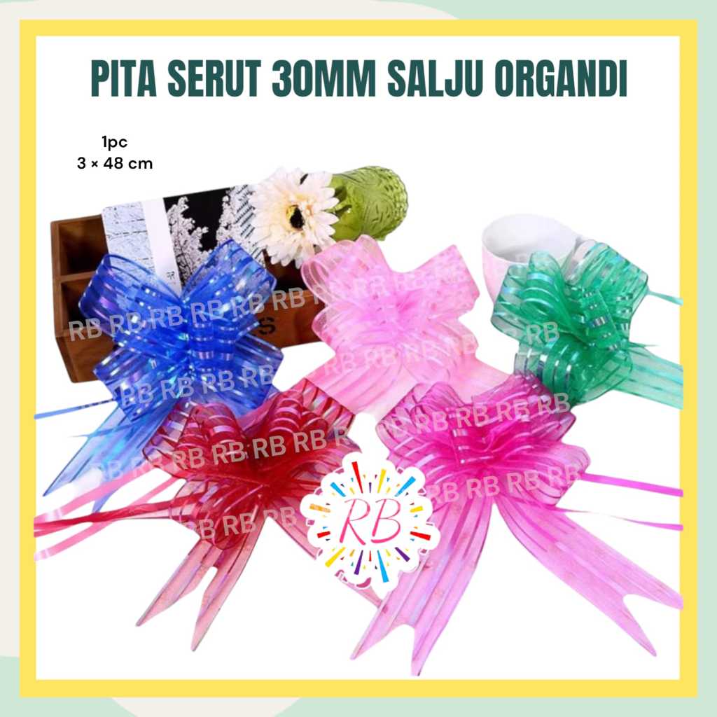 

Pita Serut SALJU ORGANDI 30 mm / Pita Tarik BESAR / Hiasan Parcel Idul Fitri Lebaran