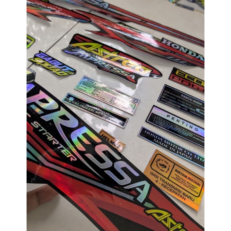 STRIPING HOLOGRAM ASTREA IMPRESSA STRIPING ASTREA IMPRESSA HOLOGRAM