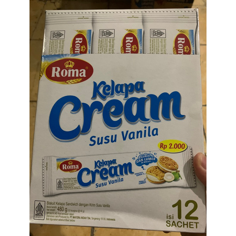 

Roma Kelapa Cream Susu Vanilla Biskuit Kelapa Sandwich Krim Susu Vanilla 480 g Isi 12 pcs