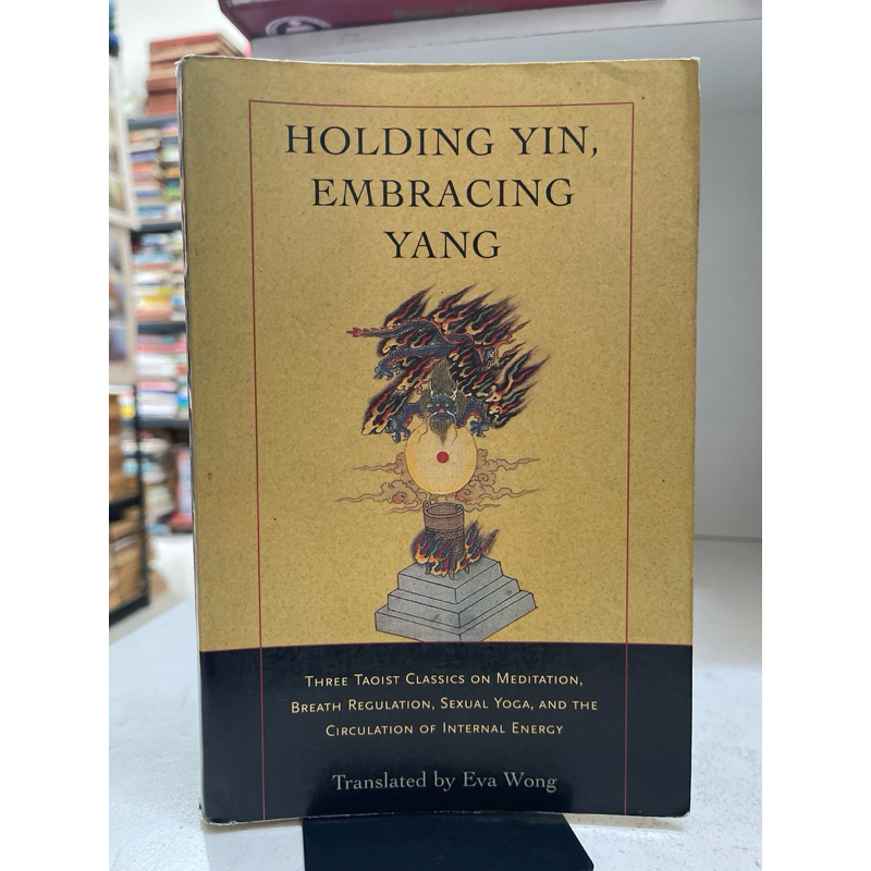 BUKU HOLDING YIN EMBRACING YANG BY EVA WONG