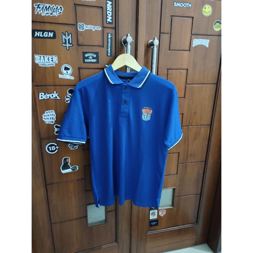 Kaos Pria Polo/Kerah NewLois Blue UK L, Terdapat Variasi Motif, 100%Original&Murah