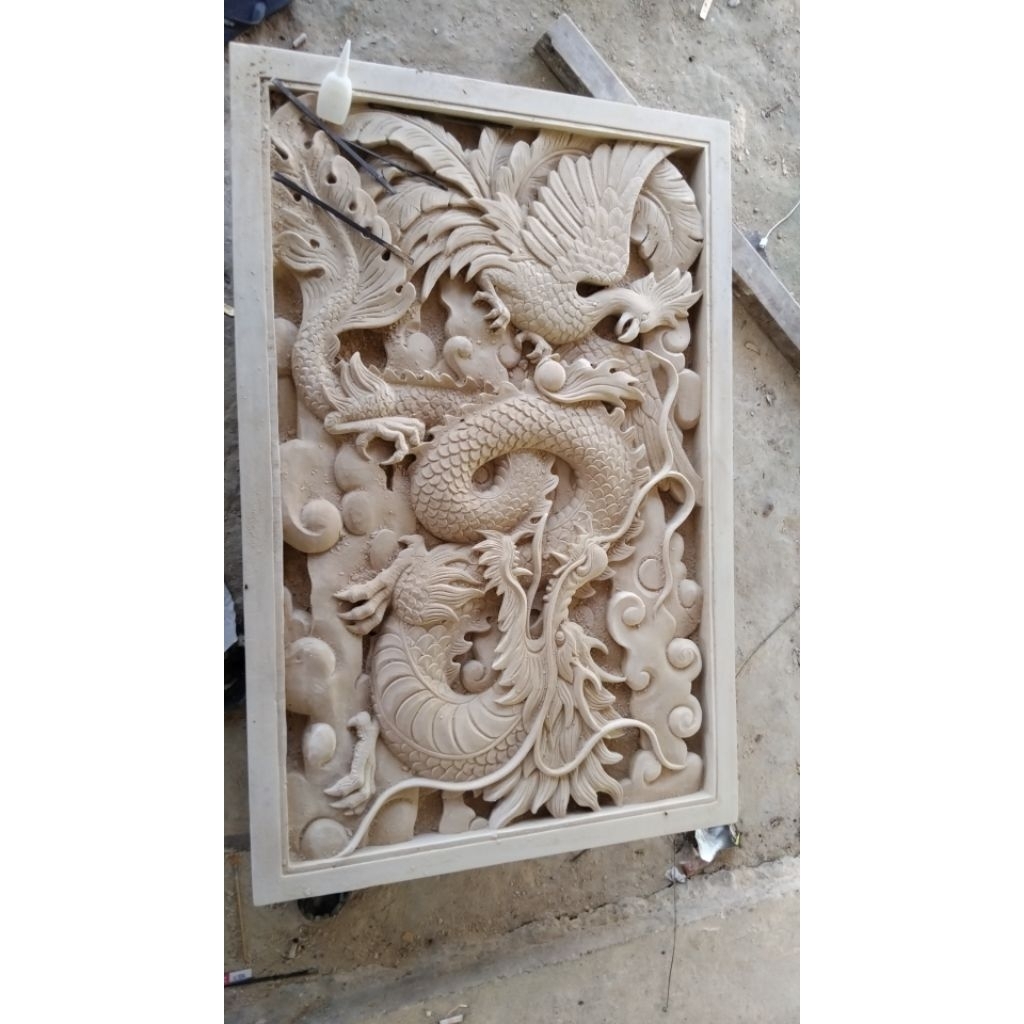 relief batu alam motif naga