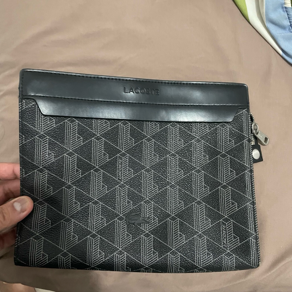 Preloved clutch lacoste black ori