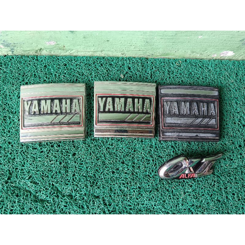 Emblem dasi Yamaha alfa