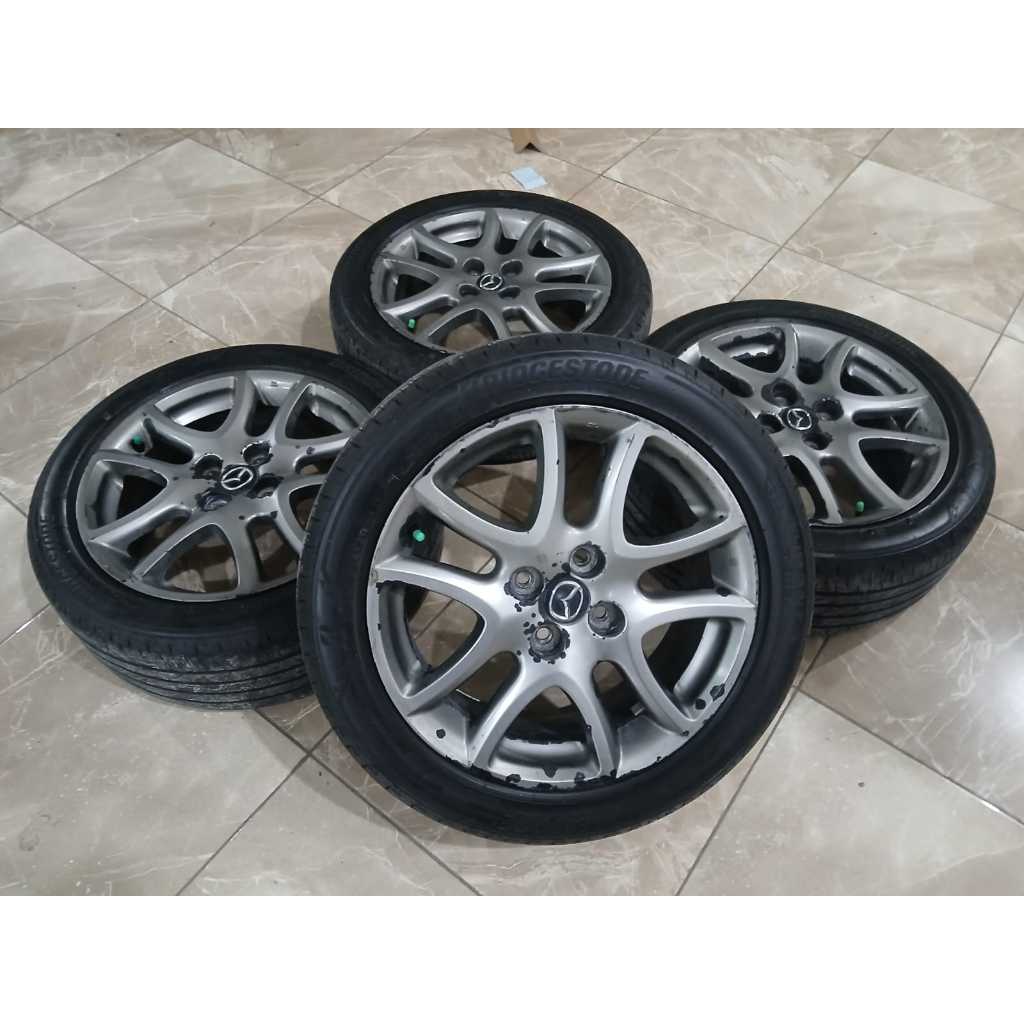 Velg pelek original bekas mobil mazda 2 ring 16 H4x100 plus ban bekas murah