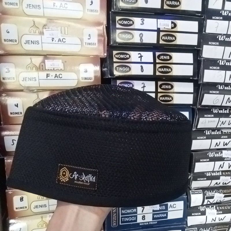 peci turki jaring atas peci hitam