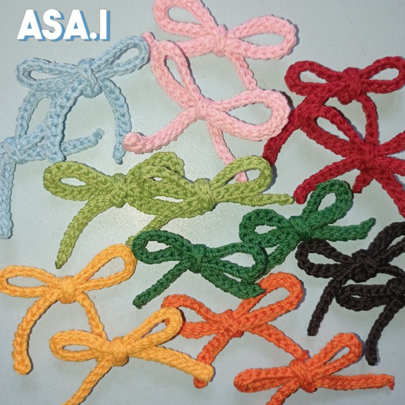 Aplikasi rajut pita / hiasan tempel.