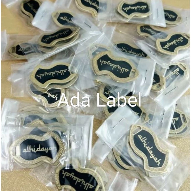 

label hijab trompah/label besi