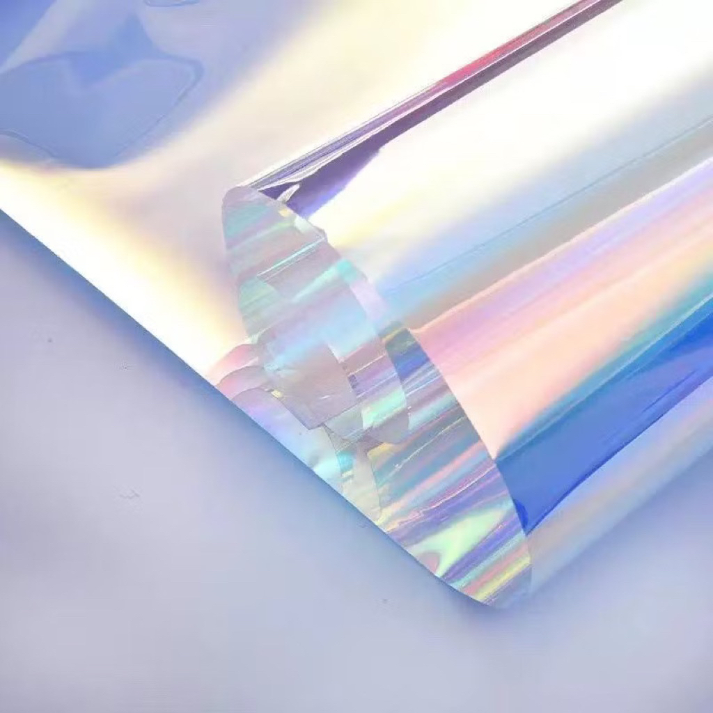 

HOLOGRAM LEMBARAN PLASTIK OPP HOLOGRAM RAINBOW TRANSPARAN PELANGI CELLOPHANE HOLOGRAM