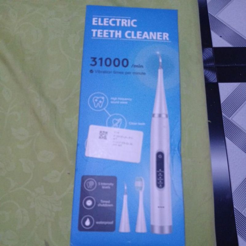 Pembersih karang gigi elektrik