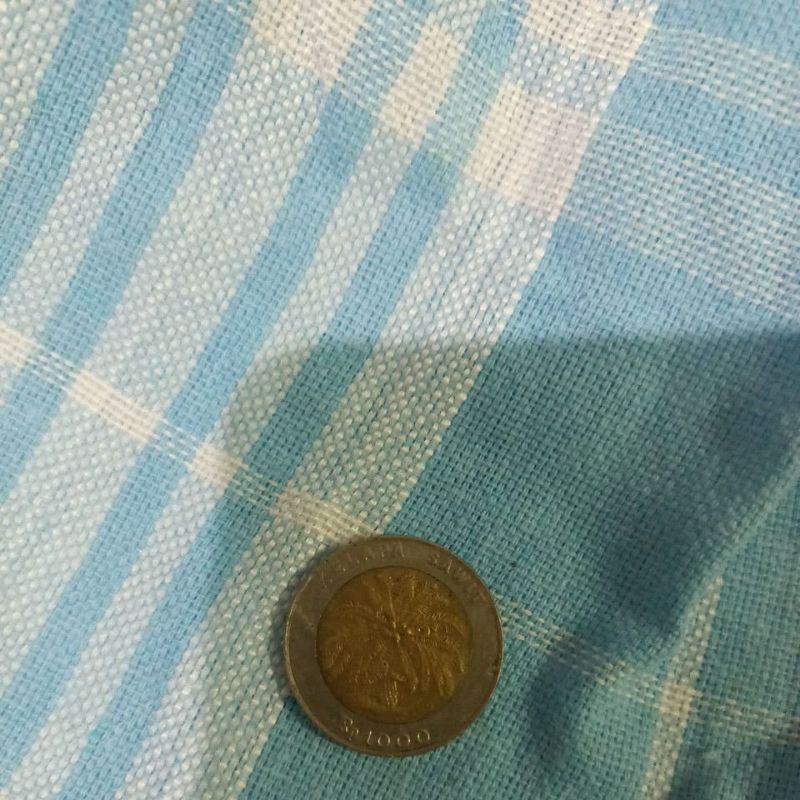 uang 1000 rupiah kelapa sawit asli