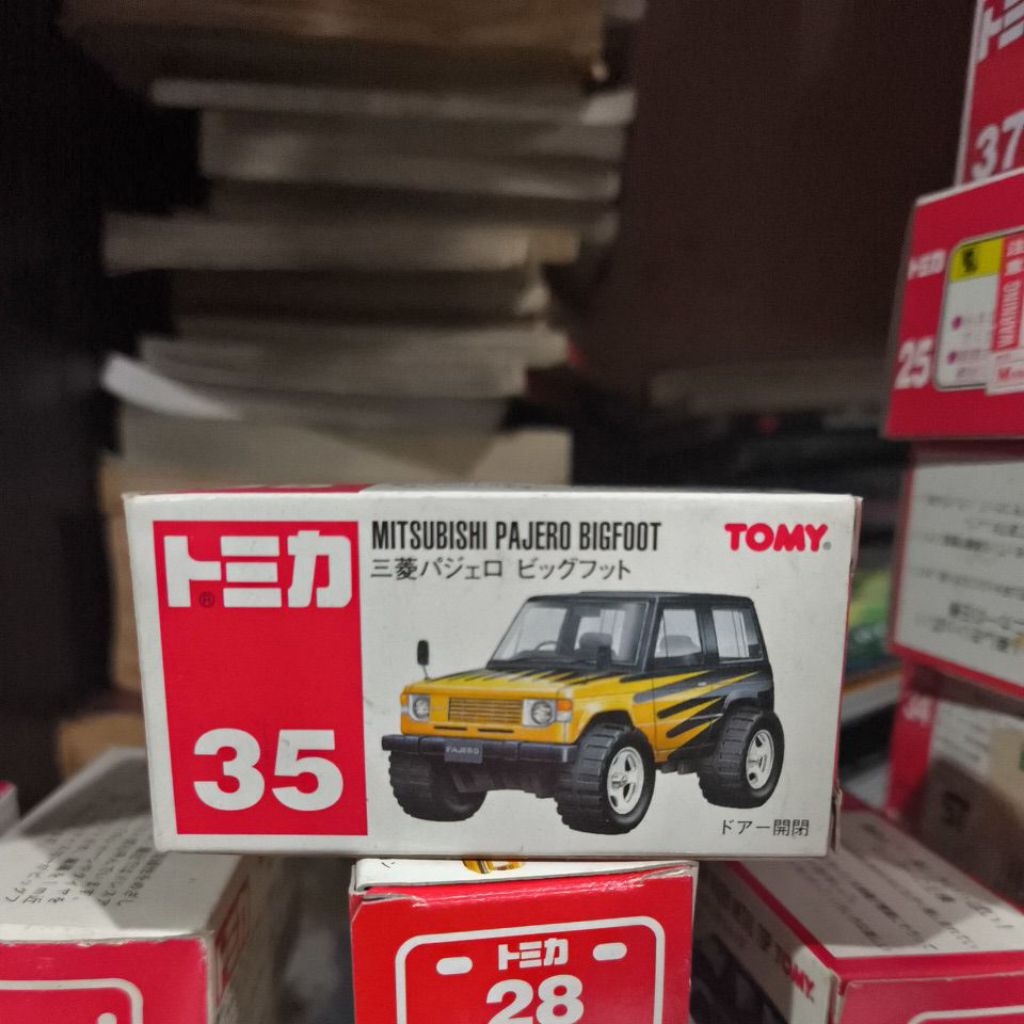Tomy Merah Tomica Reguler no 35 Mitsubishi Jeep Bigfoot Hitam Kuning
