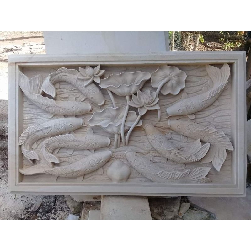ukiran batu alam motif ikan koi