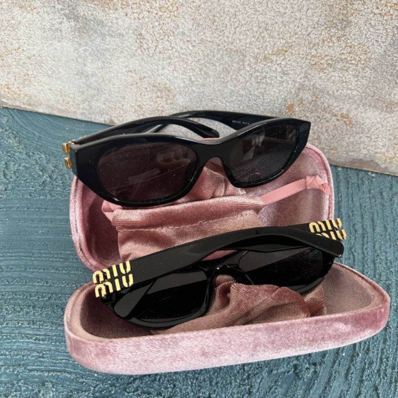 Miu Miu Oval Black Sunglasses