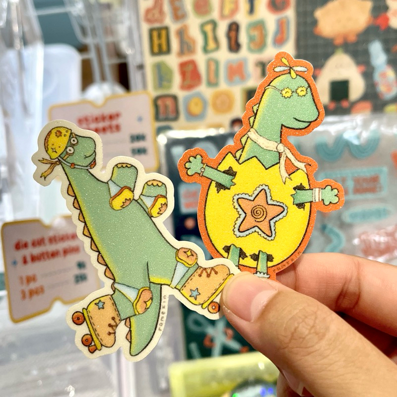 

Egg & Rollerskate Dino Glitter Die Cut Sticker | Ramekin Studio
