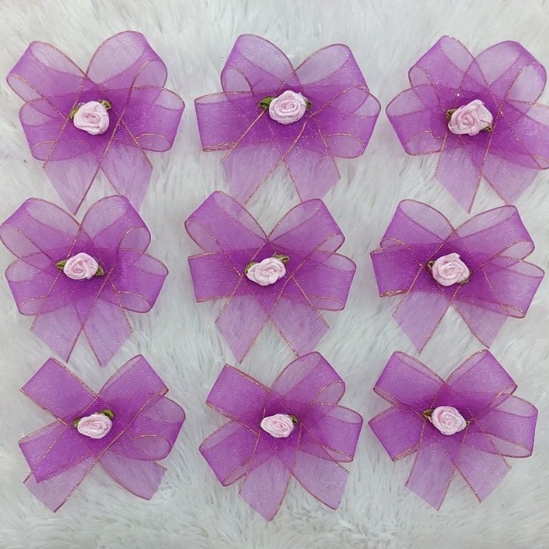 

Pita Bunga Panitia Hiasan Dress 8cm PER KAP isi 12 Pcs (sudah dapat peniti Terpisah)
