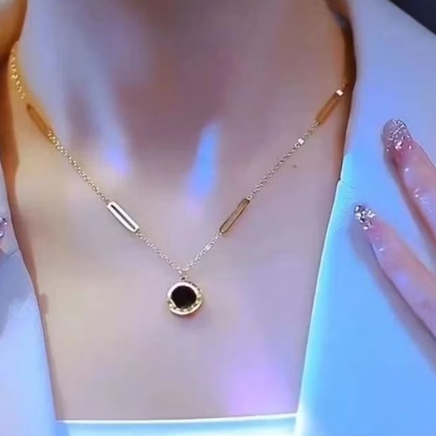 kalung titanium motif buah hitam wanita