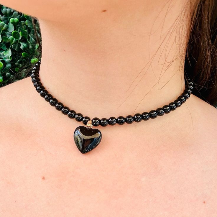 Black love heard with pearl necklace