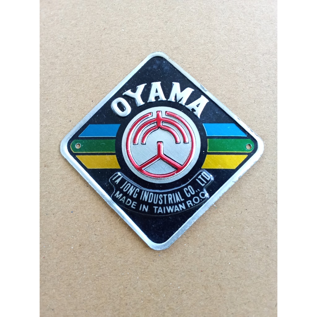 Emblem plat merk sepeda BMX Oyama strip biru hijau kuning
