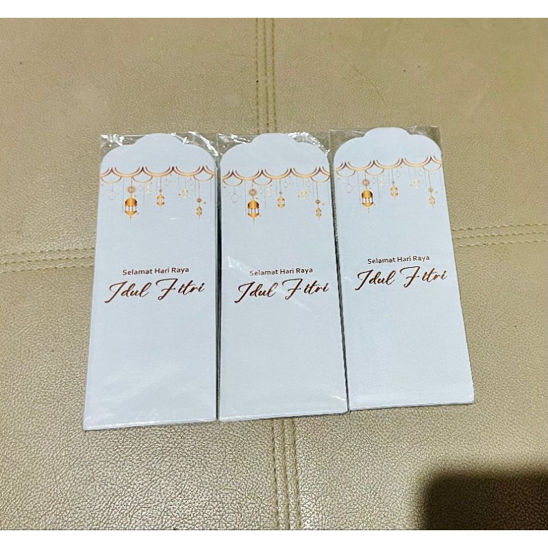 

Amplop Besar THR Lebaran 2025 Motif UCAPAN IDHUL FITRI WARNA PUTIH LAMPU EMAS 1 Pax 7 Lembar