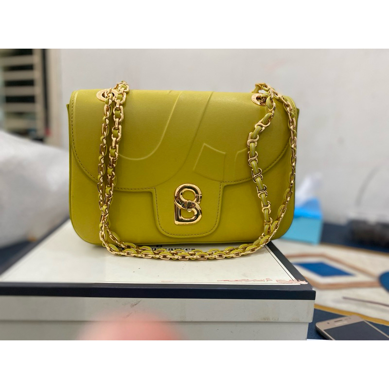 NET alma chain bag in lime tas buttonscarves preloved