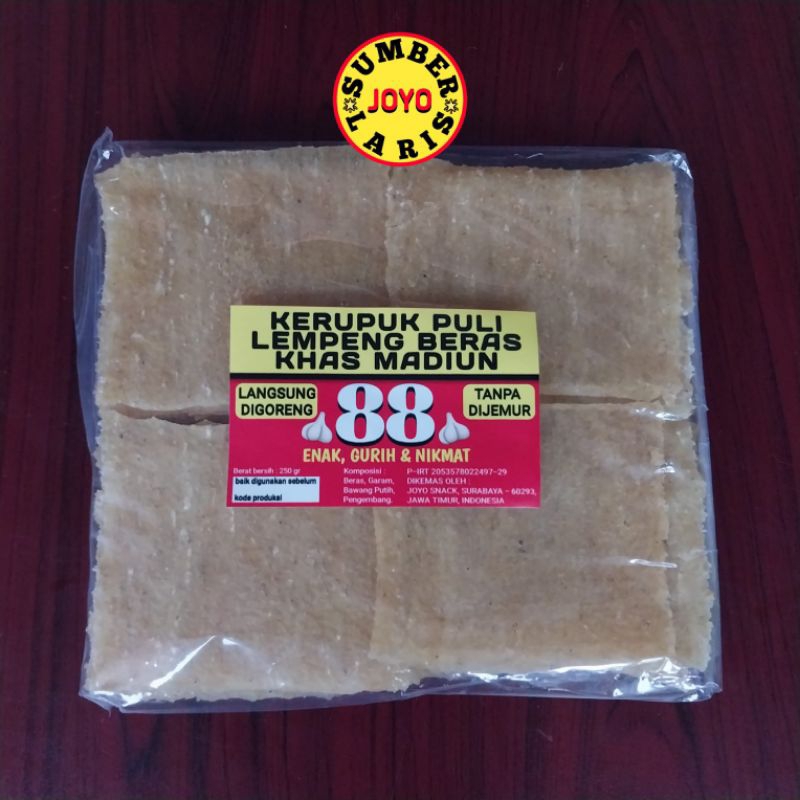 

KERUPUK PULI KWALITAS NO.1 KERUPUK PULI BAWANG KHAS MADIUN CAP "88" LEMPENG BERAS
