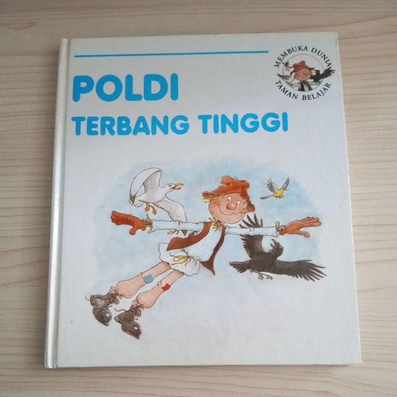 BUKU MEMBUKA DUNIA TAMAN BELAJAR POLDI TERBANG TINGGI