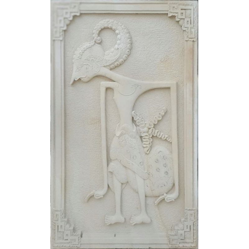 ukiran batu alam motif wayang