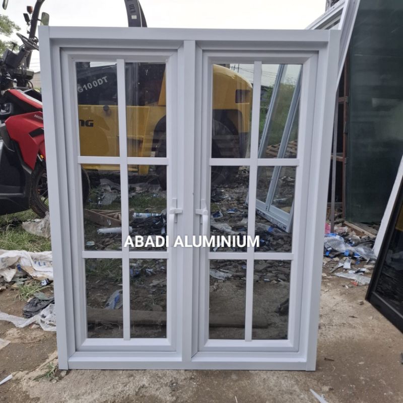 Jendela CASMEN  2daun Aluminium 3'inch L100 x T140 Ornamen