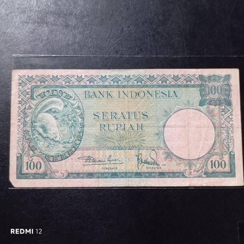 Uang Kertas Kuno 100 Rupiah Tupai Tahun 1957 Bekas Asli