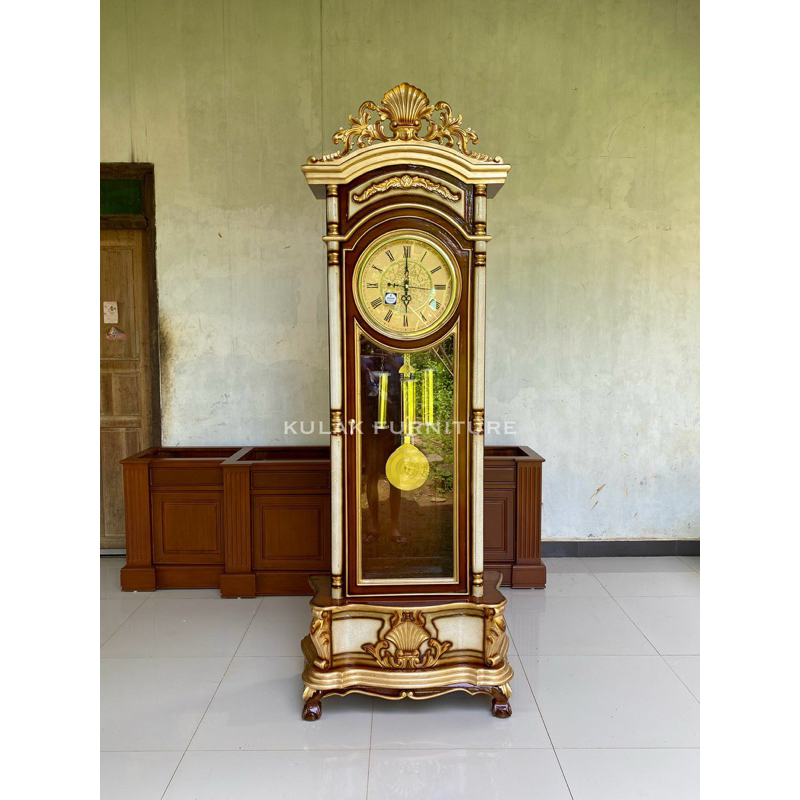 lemari jam hias ukir kayu jati / lemari jam kerang jati / lemari jam hias ruang tamu jati