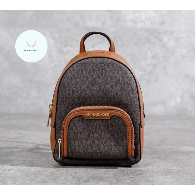 Michael Kors MK Monogram Brown Mini Backpack in Camel