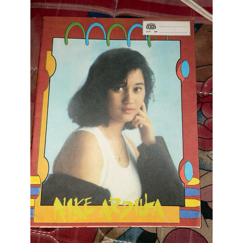 

buku tulis Nike Ardilla