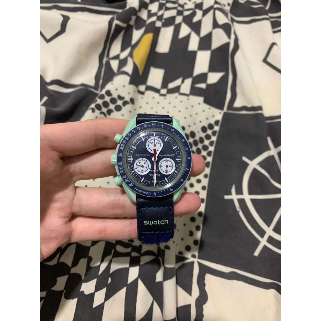 omega swatch speedmaster mission to earth