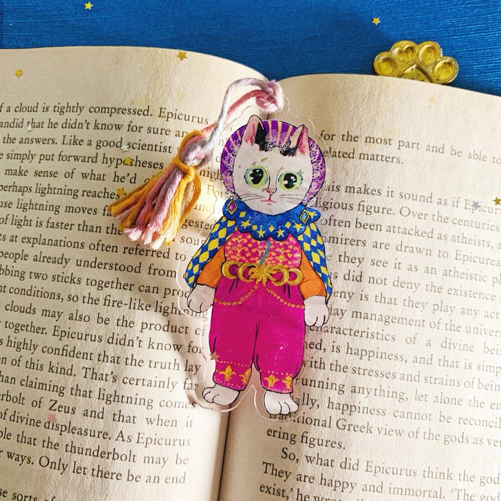 

Bookmark | Pembatas Buku acrylic kucing Queen Daphne the Celestial Guide