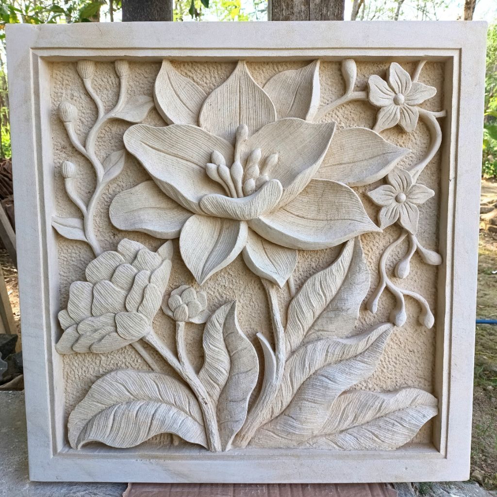 relief batu paras motif bunga