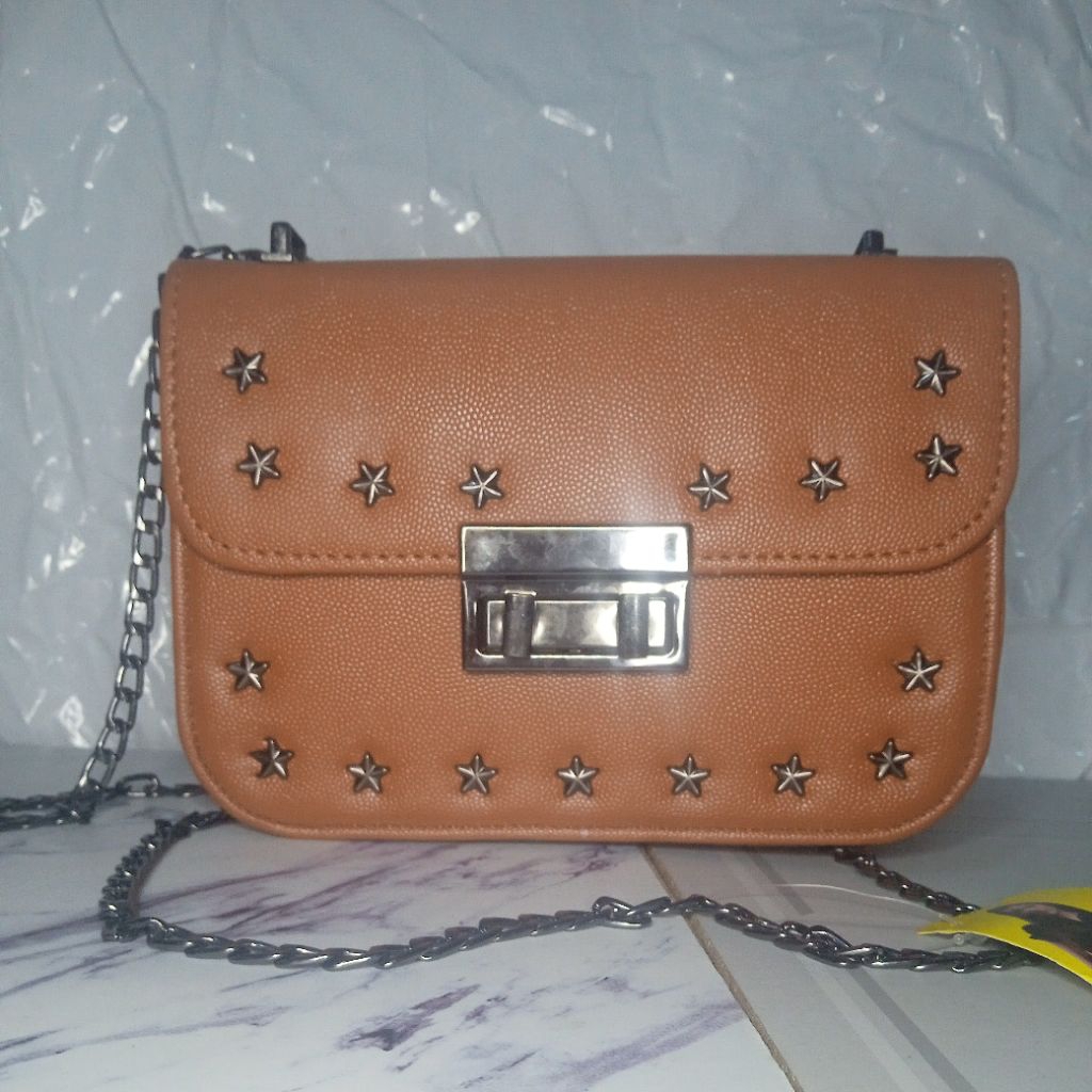 tas selempang bintang kunci putar