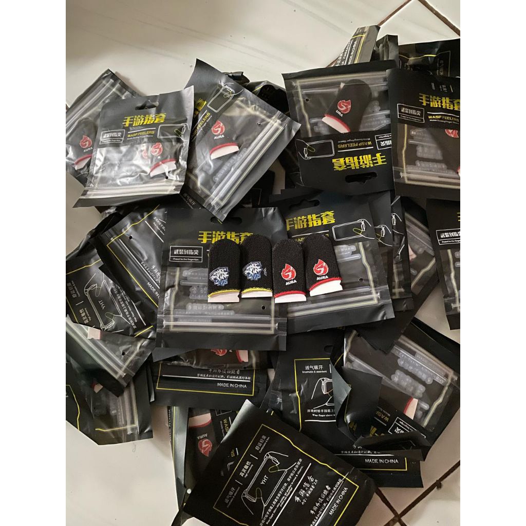 Grosir sarung jempol game 100 pasang motif campur termurah