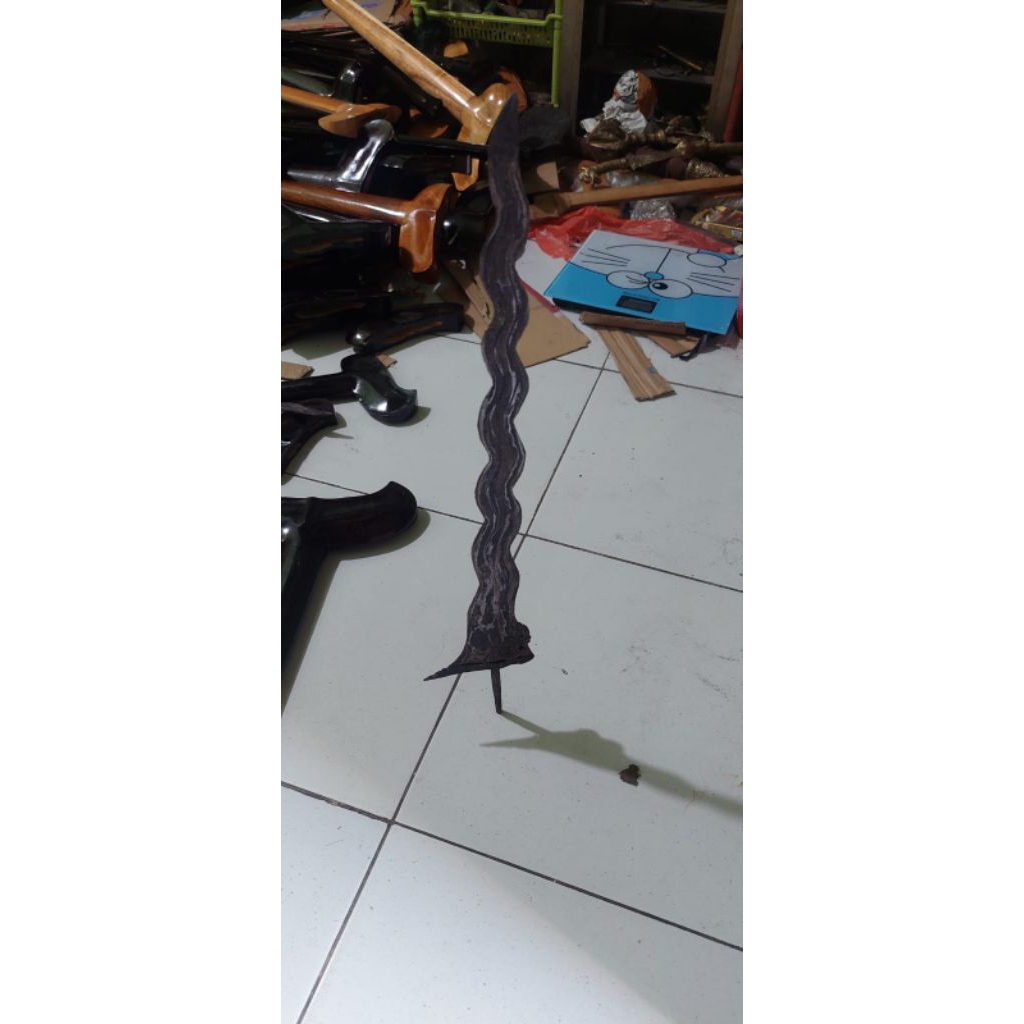 keris naga silumam berdiri peksi