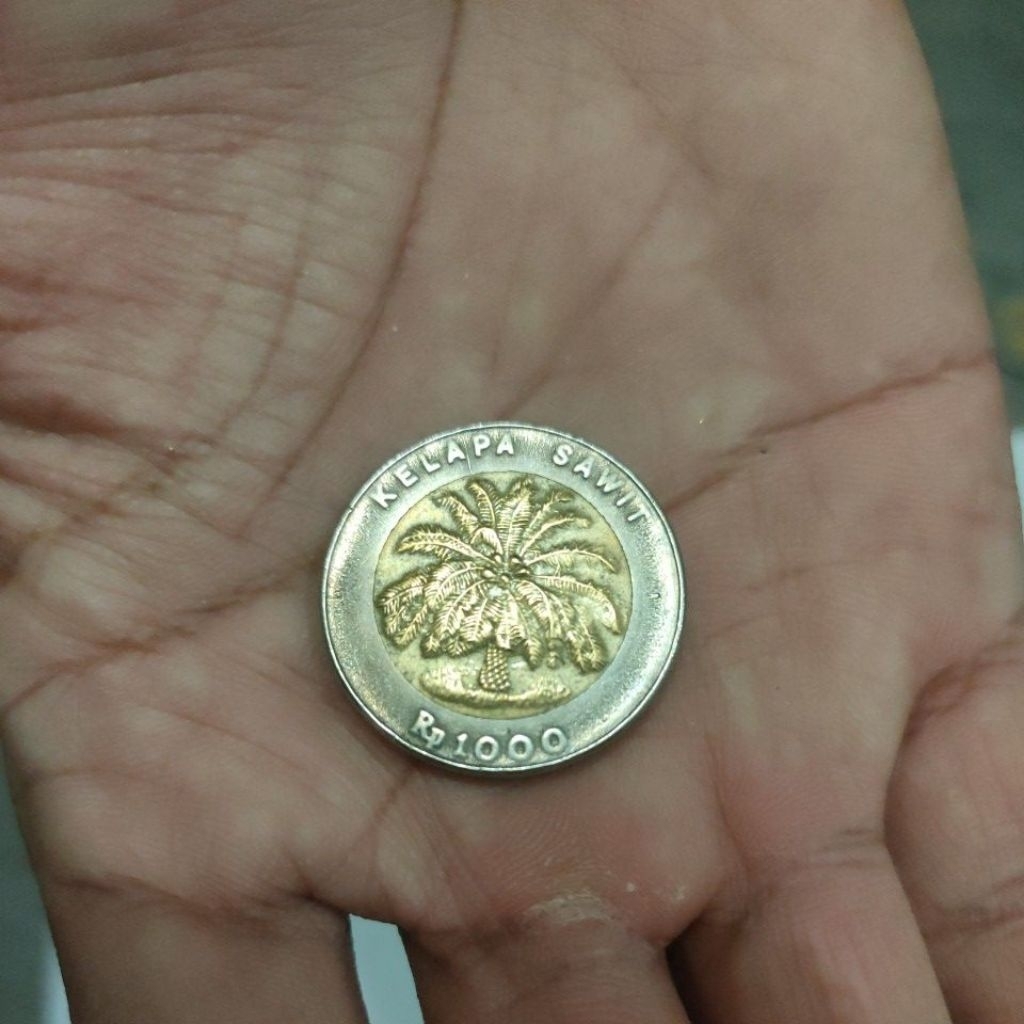 Koin kuno pecahan Rp 1.000,- kelapa sawit th 2000