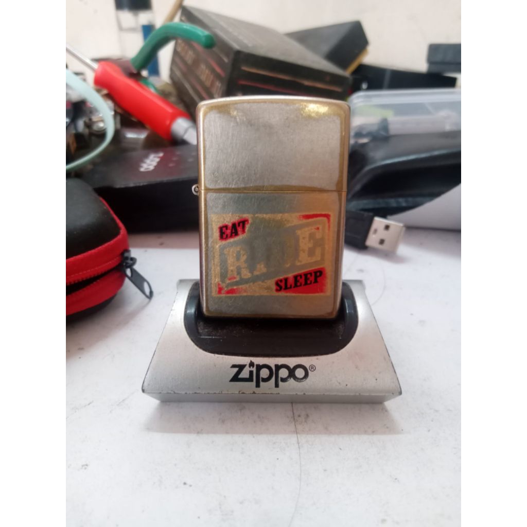 original zippo.eat ride sleep golden plate