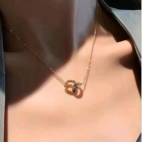 kalung wanita titanium.liontin ring double