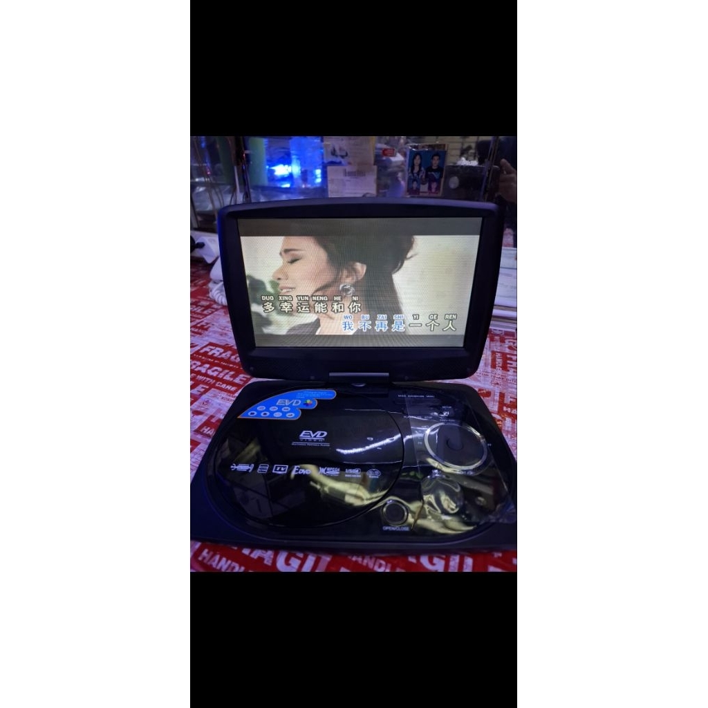 DVD TV PORTABLE EVD 10,5 INCH DVD PORTABLE EVD DVD VCD CD MP3 CD USB MOVIE DAN TV