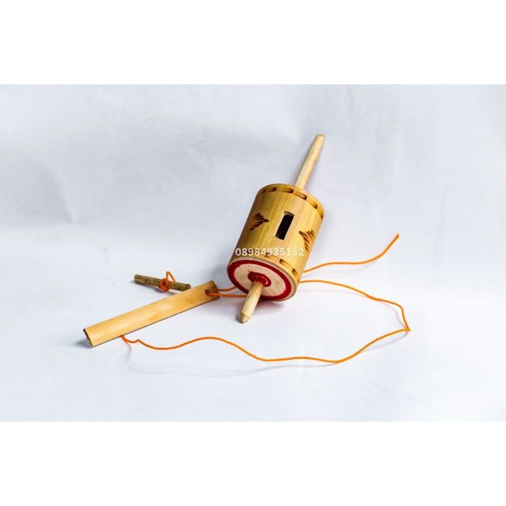 mainan gangsing bambu bunyi