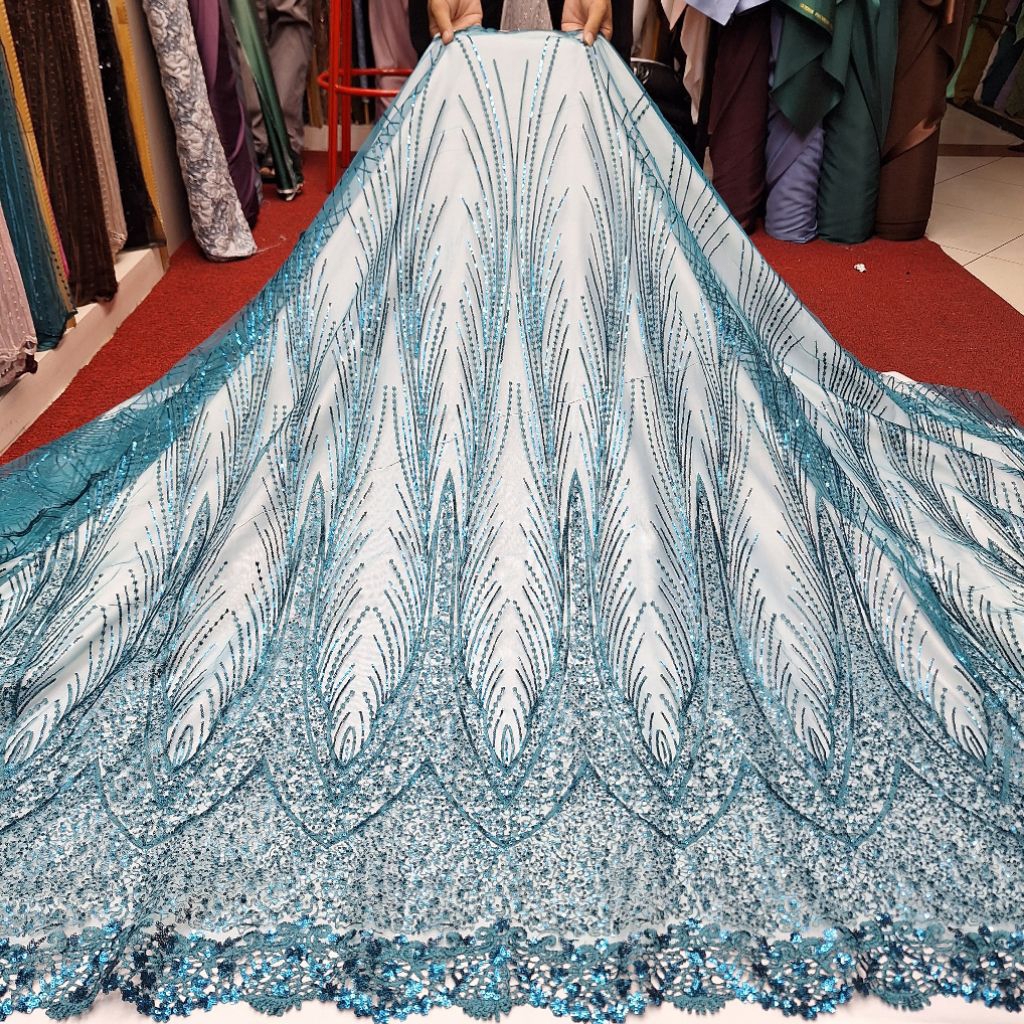 kain brokat tile payet motif bulu merak